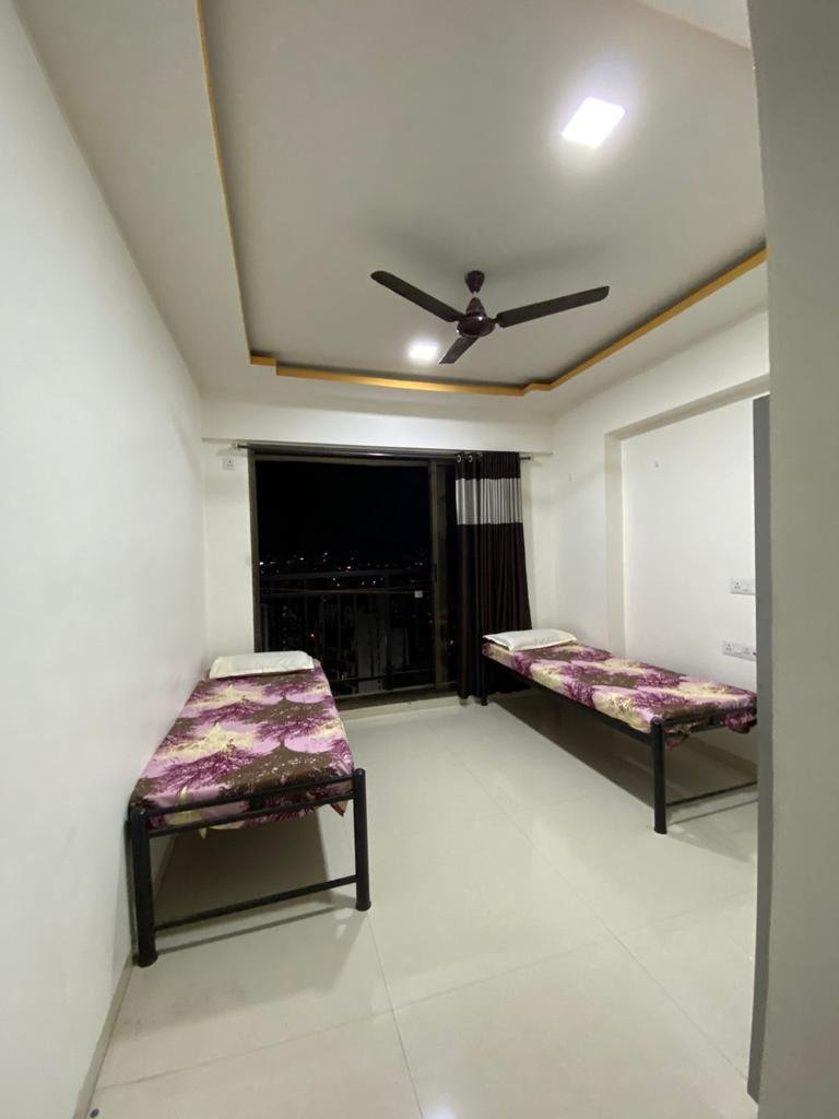 Furnished bedroom at PG in Airoli