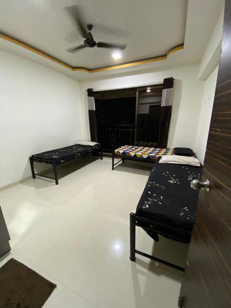 Boys PG bedroom in Airoli with study table and AC